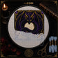 Shadow Dragon Moon cross stitch hoop displayed in witchy gothic home decor aesthetic